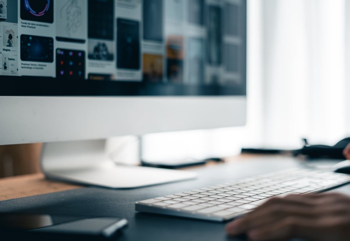 person typing ad on computer